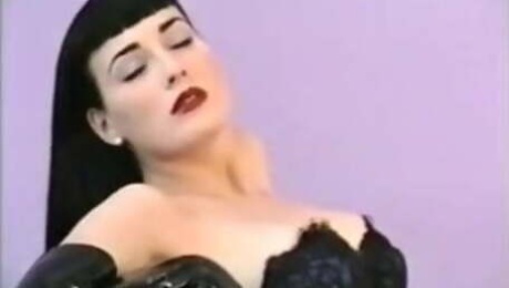 Dita Von Teese poses in corset