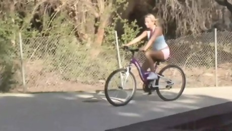 Inked blonde muff diver seduces the wandering cyclist into using a double ended dildo